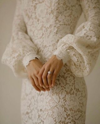The Mustelin gown by @miller_white_ .
Timeless elegance made of a floral patterned organic lace and organic cotton.
.
Paired with the sustainable jewellery from @gaiastudiono.1 
.
.
Dress: @miller_white_ 
Jewellery: @gaiastudiono.1 
Model: @tiaskarin 
Hair & Makeup: @laurenirwinhmua 
Photography: @isabellath
.
.
.
#sustainablebride #sustainablebridalwear #sustainablewedding #consciousbride #ecowedding #ecofriendlywedding #lacegown #organicbridal #bridalideas #bridalinspo #bridetobe #ukbridetobe #bride2021 #sustainablejewelry #sustainablejewellery #weddingshoot #weddingrings #weddingbands #engagementring #bridalstyle #weddingphotography #wedding2021